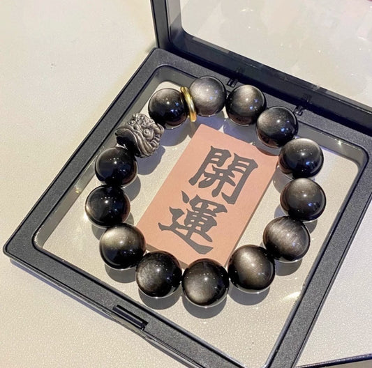 Obsidian Guardian Lion Bracelet – Hand-Blessed by a Feng-Shui Master   Channel ancient Eastern power to amplify your luck, career, wealth and health.
